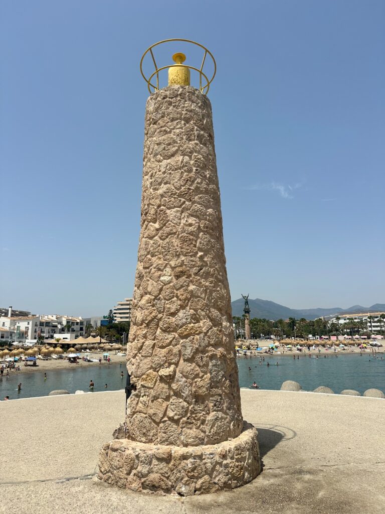 Hand-painted penguin stone #1158 hidden at Playa de Puerto Banús, Marbella, Spain (photo 4 of 5)