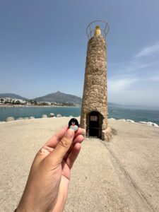 Hand-painted penguin stone #1158 hidden at Playa de Puerto Banús, Marbella, Spain