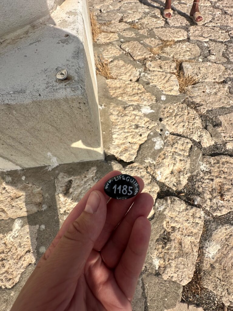 Hand-painted penguin stone #1185 hidden at Espigon del Puerto de Estepona, Estepona, Spain (photo 2 of 4)