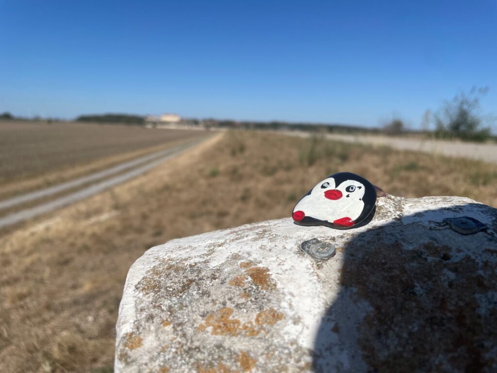 Hand-painted penguin stone #1311 hidden at Cross Road, Engelhartstetten, Austria (photo 3 of 4)