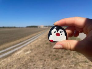 Hand-painted penguin stone #1311 hidden at Cross Road, Engelhartstetten, Austria