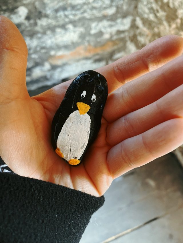 Hand-painted penguin stone #34 hidden at Sauna Tower, Tallinn, Estonia (photo 2 of 5)