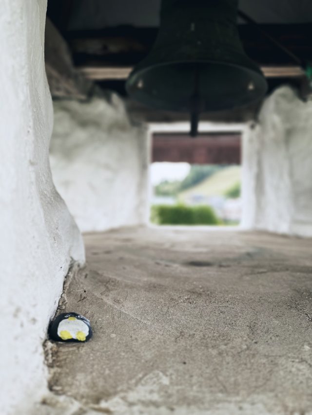 Hand-painted penguin stone #4 hidden at White Chapel, Lapszanka, Poland (photo 2 of 5)
