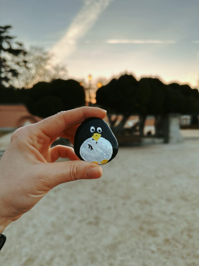 Hand-painted penguin stone #87 hidden at Monumento al Doctor Benavente, Madrid, Spain (photo 2 of 5)