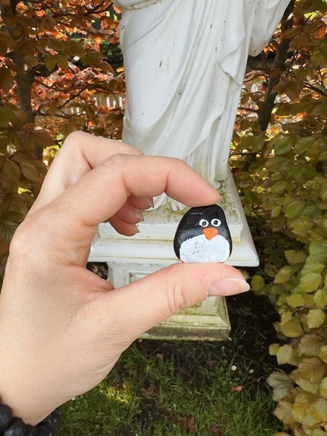 Hand-painted penguin stone #249 hidden at Zonnewijzerspad, Zaanse Schans, Netherlands (photo 4 of 5)