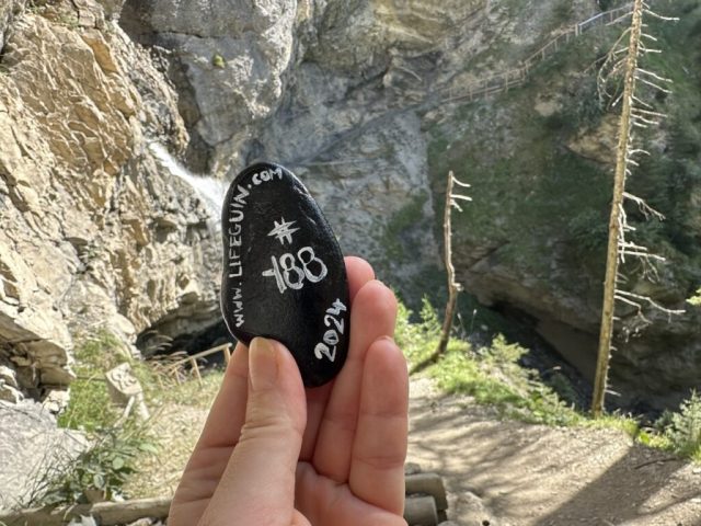 Hand-painted penguin stone #188 hidden at Sprutz Waterfall, Murren, Switzerland (photo 3 of 5)