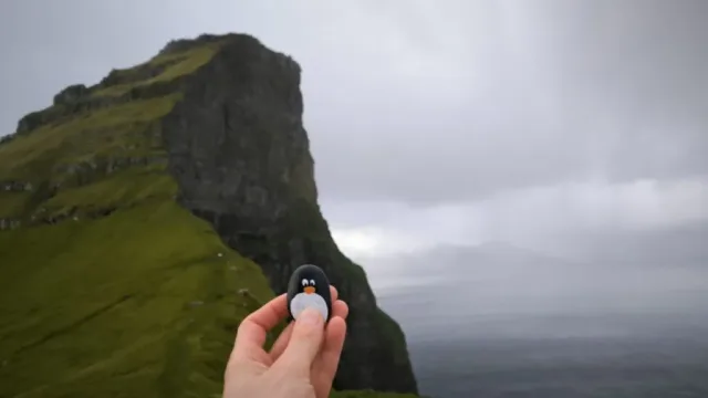 Hand-painted penguin stone #237 hidden at Kallur Lighthouse, Kalsoy, Faroe Islands (photo 5 of 5)
