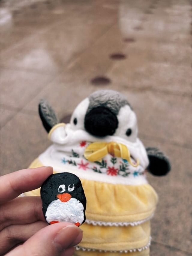 Hand-painted penguin stone #335 hidden at Tsuzumi-mon Gate, Kanazawa, Japan (photo 4 of 5)