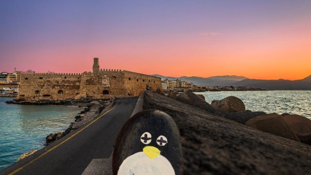 Hand-painted penguin stone #68 hidden at Rocca a Mare Fortress, Heraklion, Greece