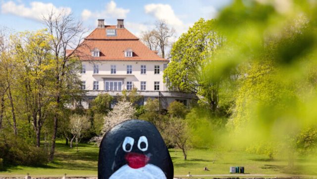 Hand-painted penguin stone #426 hidden at Fornebu Hovedgard, Oslo, Norway