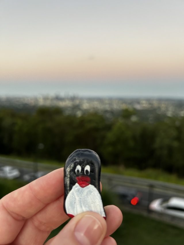 Hand-painted penguin stone #435 hidden at Mount Coot-Tha Summit Lookout, Brisbane, Australia (photo 2 of 5)