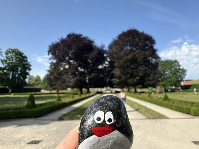 Hand-painted penguin stone #449 hidden at Castle Gardens, Cesky Krumlov, Czechia (photo 4 of 5)