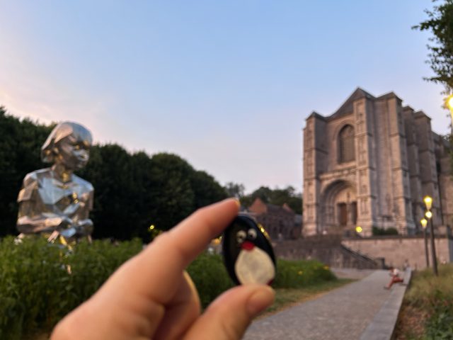 Hand-painted penguin stone #588 hidden at Lucy and the Butterflies, Mons, Belgium (photo 3 of 5)