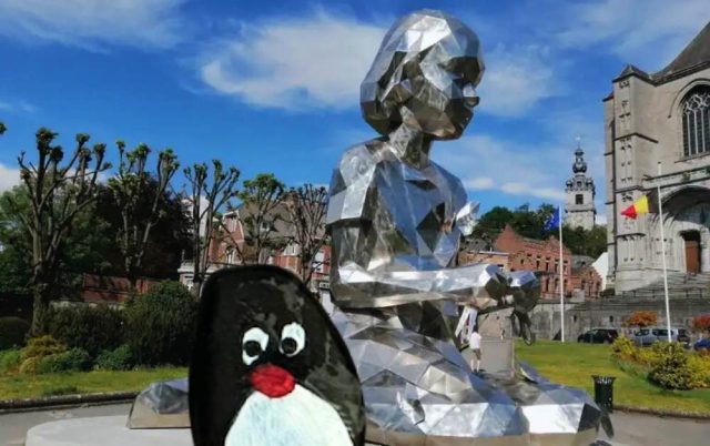 Hand-painted penguin stone #588 hidden at Lucy and the Butterflies, Mons, Belgium