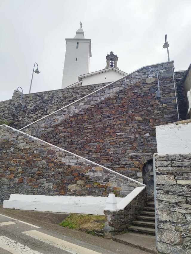 Hand-painted penguin stone #60 hidden at Faro de Luarca, Luarca, Spain (photo 2 of 5)