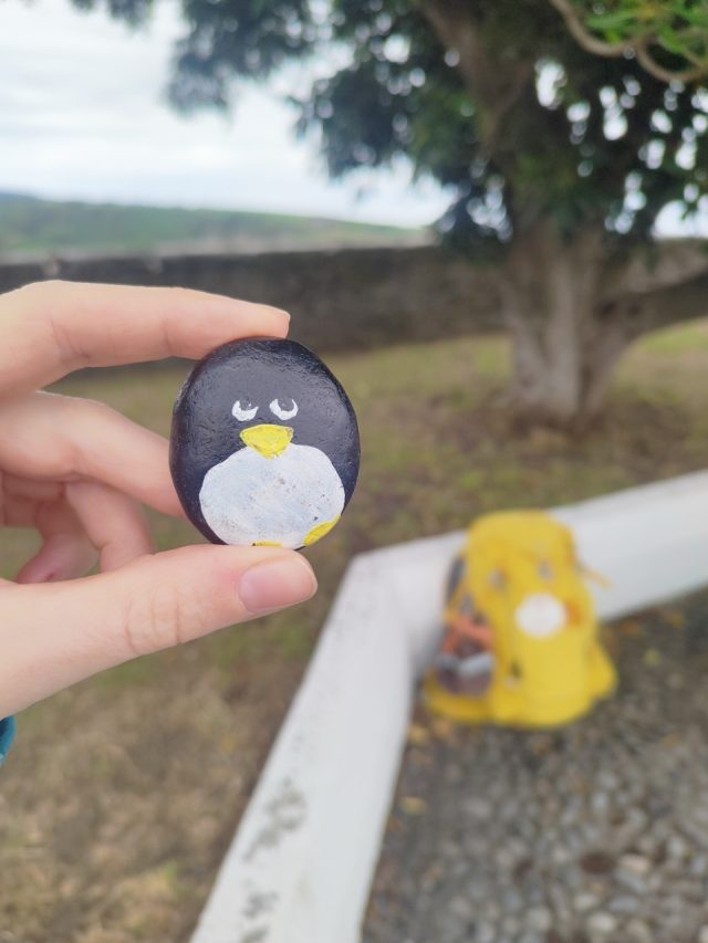 Hand-painted penguin stone #60 hidden at Faro de Luarca, Luarca, Spain (photo 3 of 5)