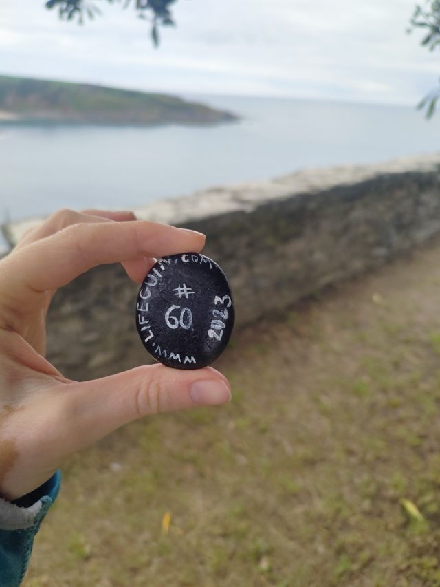 Hand-painted penguin stone #60 hidden at Faro de Luarca, Luarca, Spain (photo 4 of 5)