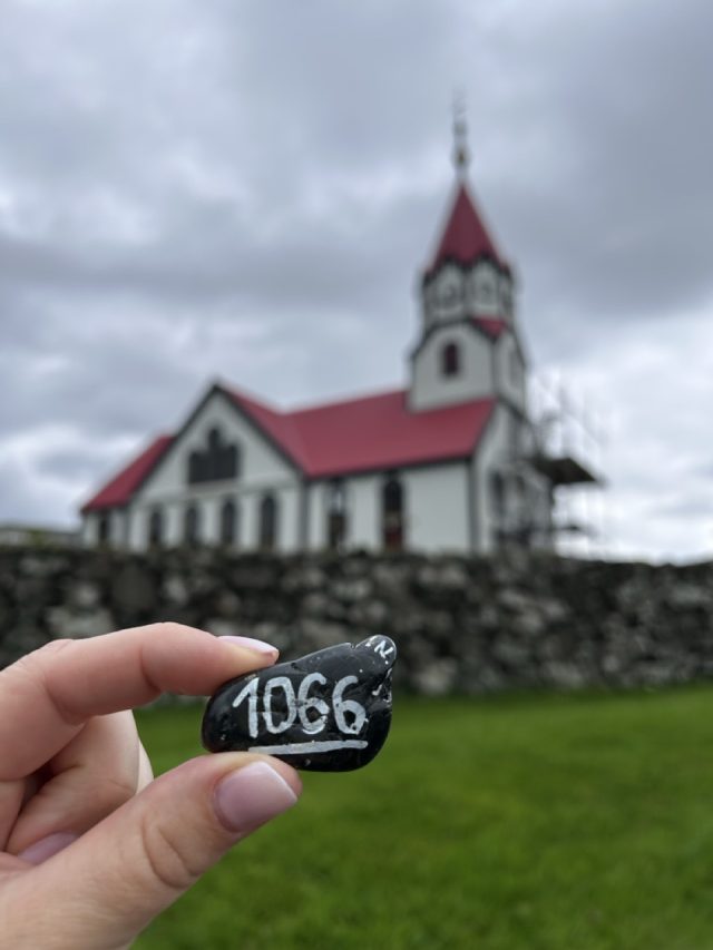 Hand-painted penguin stone #1066 hidden at Sandavags Kirkja, Sandavagur, Faroe Islands (photo 4 of 5)