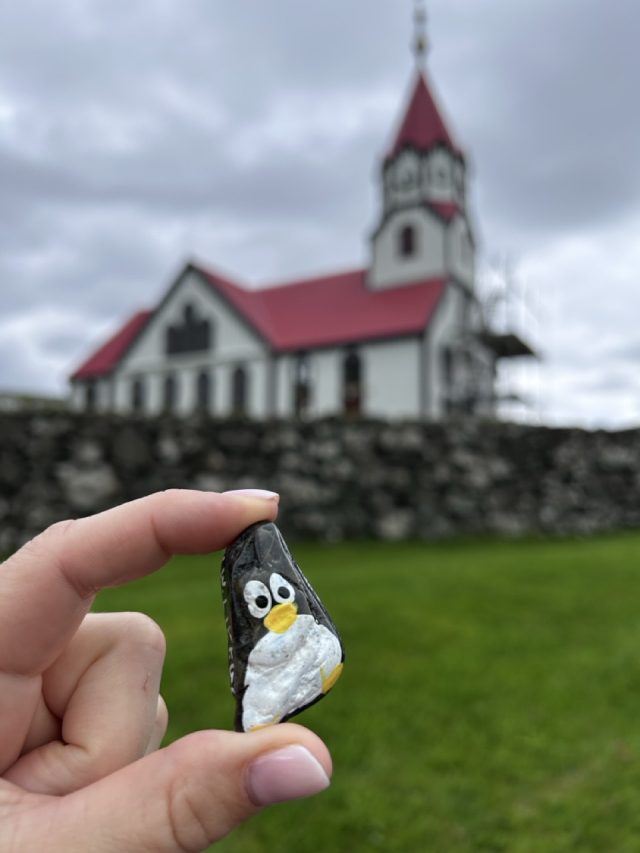 Hand-painted penguin stone #1066 hidden at Sandavags Kirkja, Sandavagur, Faroe Islands (photo 5 of 5)