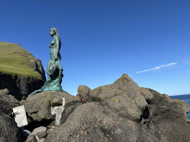 Hand-painted penguin stone #412 hidden at The Seal Woman, Mikladalur, Faroe Islands (photo 2 of 5)
