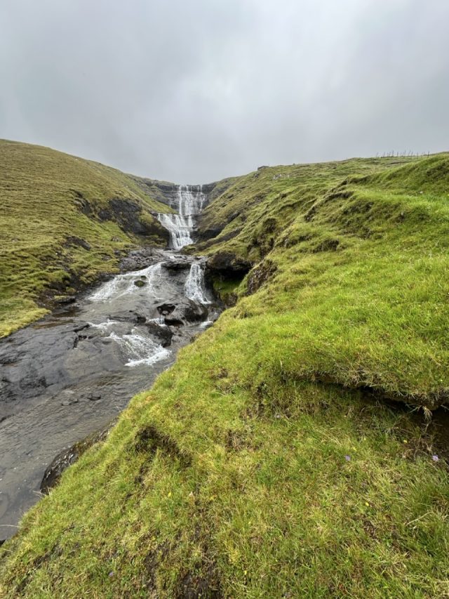 Hand-painted penguin stone #557 hidden at Waterfall, Hosvik, Faroe Islands (photo 2 of 5)