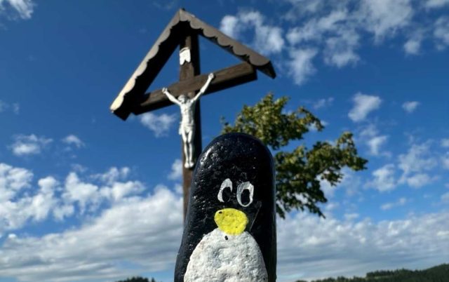 Hand-painted penguin stone #600 hidden at Tree next to the Cross, Chmelnica, Slovakia
