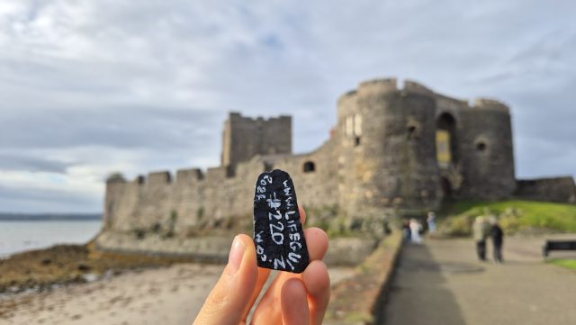 Hand-painted penguin stone #220 hidden at Carrickfergus Castle, Carrickfergus, United Kingdom (photo 3 of 5)