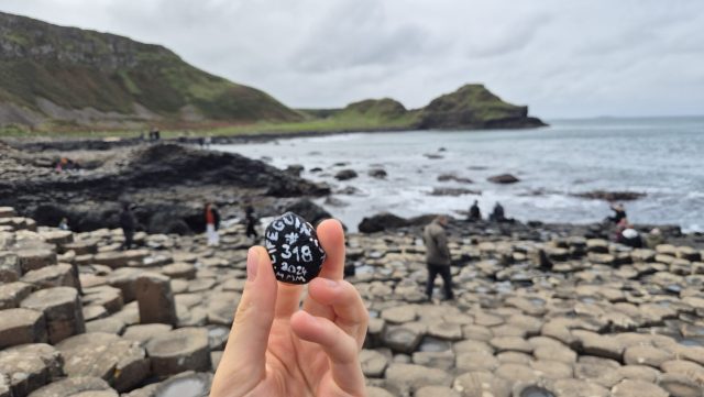 Hand-painted penguin stone #318 hidden at Giant's Causeway, County Antrim, United Kingdom (photo 4 of 5)