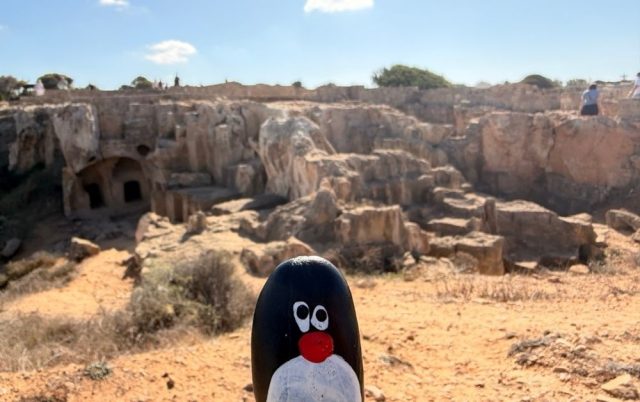 Hand-painted penguin stone #711 hidden at Close to Tomb 2 at Tombs of Kings, Paphos, Cyprus