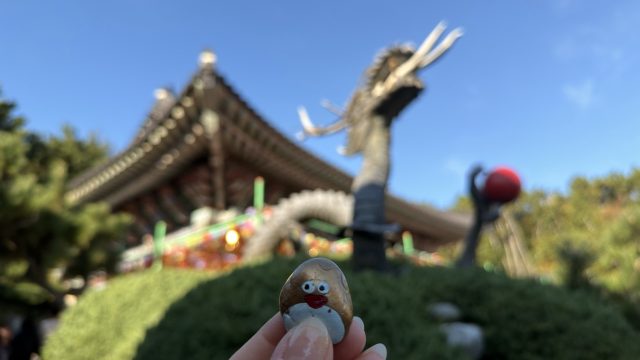 Hand-painted penguin stone #509 hidden at Stone Dragon at Haedong Yonggungsa Temple, Busan, South Korea (photo 2 of 5)