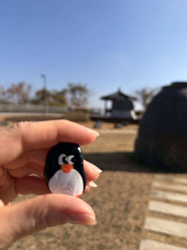 Hand-painted penguin stone #770 hidden at Pagoda at the Dora Observatory, DMZ, South Korea (photo 2 of 5)