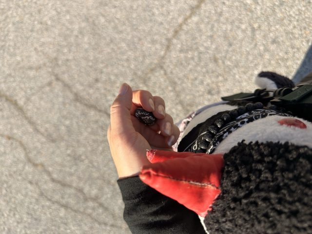 Hand-painted penguin stone #773 hidden at Sign at Parking lot, DMZ, South Korea (photo 5 of 5)