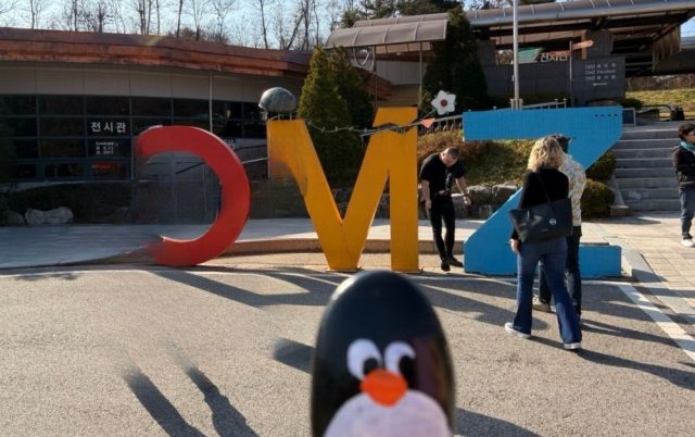 Hand-painted penguin stone #794 hidden at DMZ Sign, DMZ, South Korea