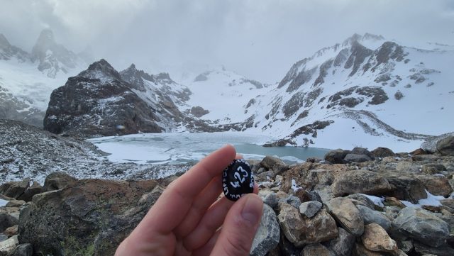 Hand-painted penguin stone #423 hidden at Laguna de los Tres, El Chalten, Argentina (photo 2 of 5)