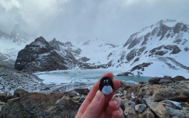 Hand-painted penguin stone #423 hidden at Laguna de los Tres, El Chalten, Argentina