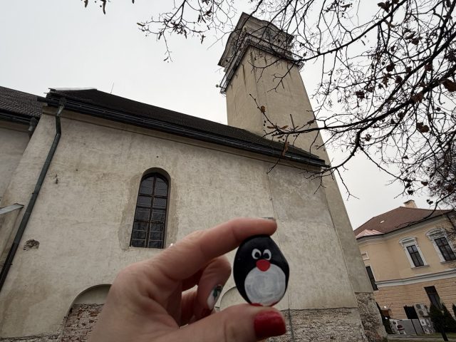 Hand-painted penguin stone #686 hidden at St. Egidia Church, Poprad, Slovakia (photo 4 of 5)