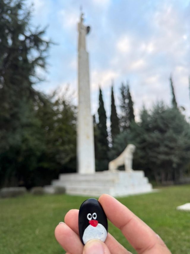 Hand-painted penguin stone #710 hidden at Statue of Athena, Athens, Greece (photo 5 of 5)