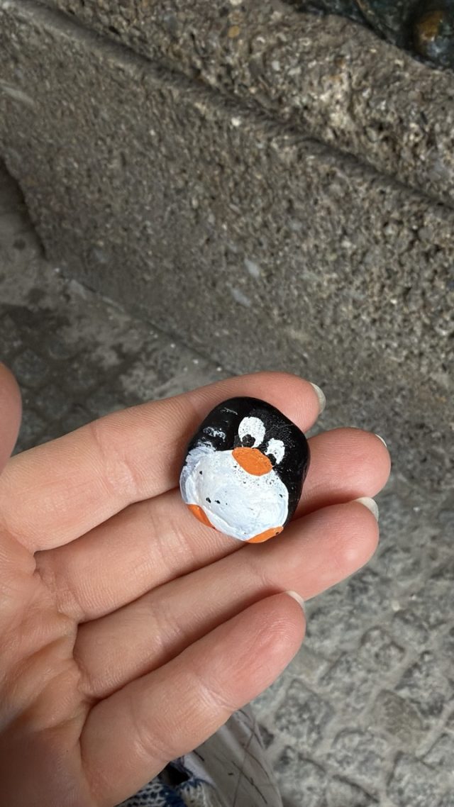 Hand-painted penguin stone #808 hidden at Pieta by Anna Chromy, Salzburg, Austria (photo 4 of 5)
