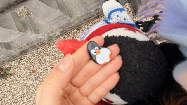Hand-painted penguin stone #809 hidden at Mirabellgarten, Salzburg, Austria (photo 2 of 5)
