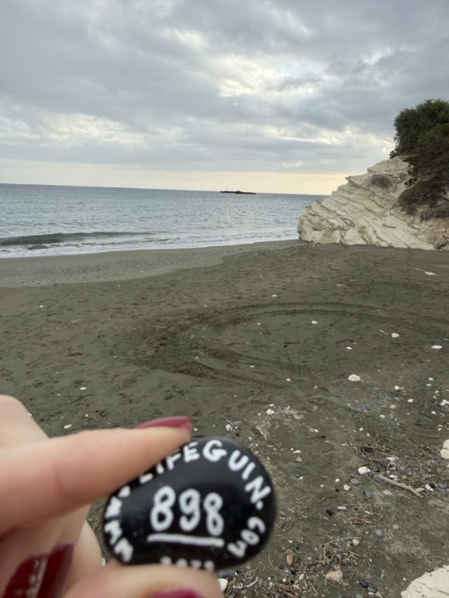 Hand-painted penguin stone #898 hidden at Governor's Beach, Cyprus (photo 4 of 5)