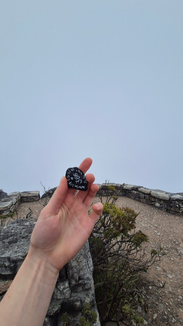 Hand-painted penguin stone #386 hidden at Top of Table Mountain, Cape Town, South Africa (photo 4 of 5)