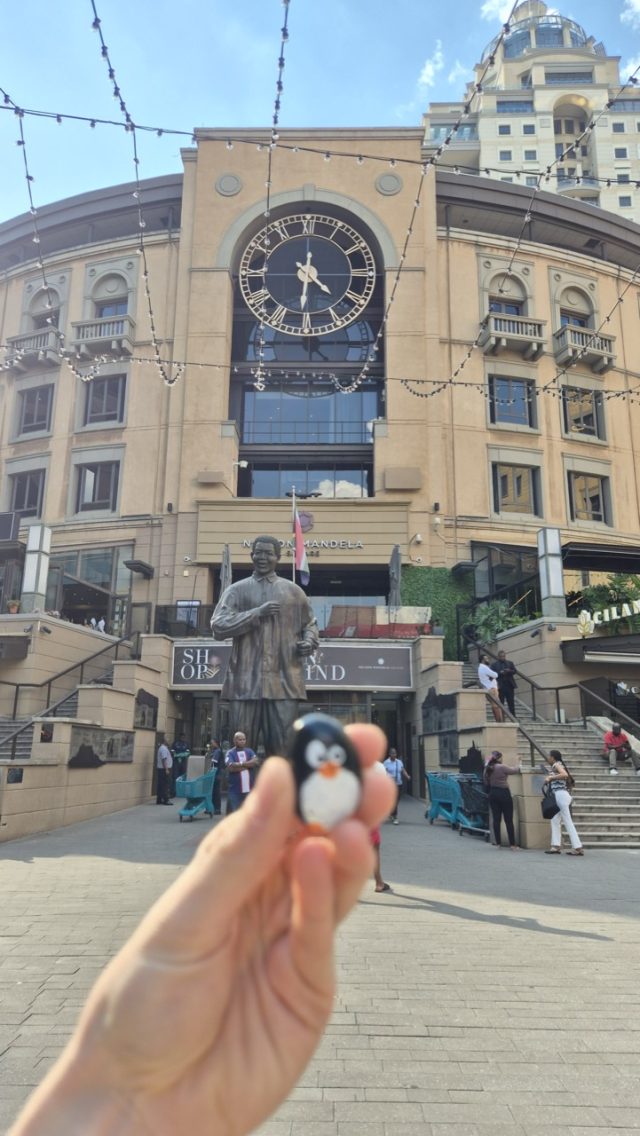 Hand-painted penguin stone #824 hidden at Nelson Mandela Square, Johannesburg, South Africa (photo 4 of 5)
