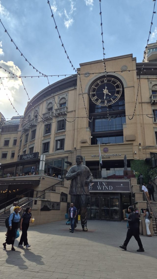 Hand-painted penguin stone #824 hidden at Nelson Mandela Square, Johannesburg, South Africa (photo 5 of 5)