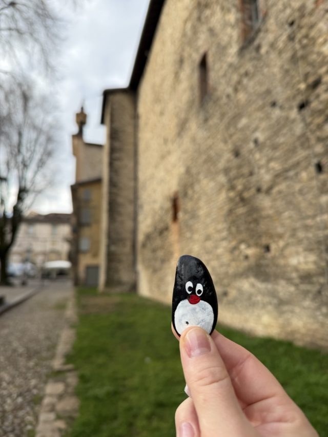 Hand-painted penguin stone #927 hidden at Monumento alla Lente, Bergamo, Italy (photo 4 of 5)