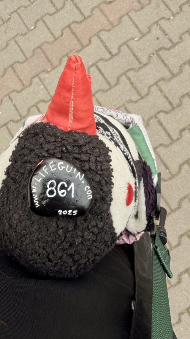 Hand-painted penguin stone #861 hidden at Park Cihelna, Prague, Czechia (photo 3 of 5)
