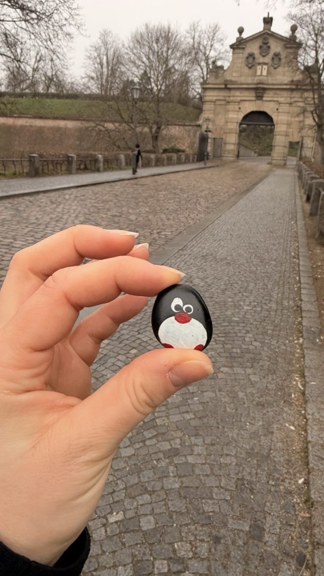 Hand-painted penguin stone #880 hidden at Leopold Gate in Vysehrad, Prague, Czechia (photo 2 of 5)