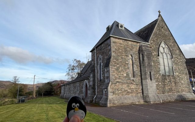 Hand-painted penguin stone #1078 hidden at St. Agatha's Catholic Church, Glenflesk, Ireland