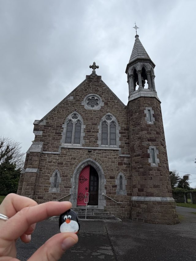 Hand-painted penguin stone #1134 hidden at Church of the Immaculate Conception, Valentia, Ireland (photo 2 of 5)