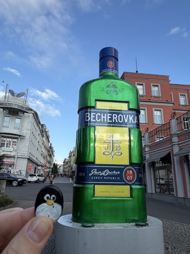 Hand-painted penguin stone #1018 hidden at The Home of Becherovka, Karlove Vary, Czechia (photo 3 of 5)
