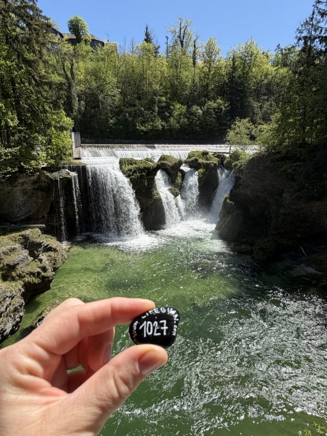 Hand-painted penguin stone #1027 hidden at Traunfall Waterfalls, Roitham, Austria (photo 2 of 5)